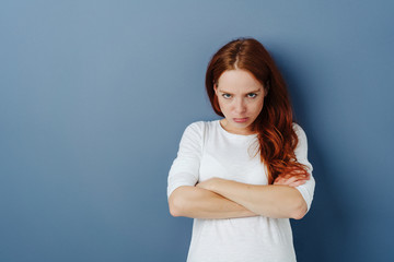 Sulky young woman pouting at the camera