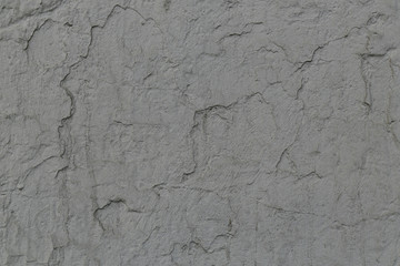 gray painted rough concrete wall surface texture with cracks