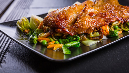 Peking duck breast with pak choi and vegetables