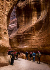 tourists and horse carriage in the Siq canyon.Petra Jordan,.January, 30, 2020
