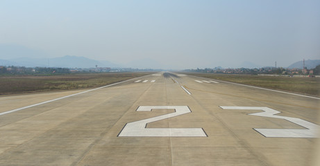 Empty runway in sunny day