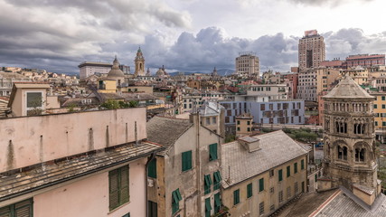 Fototapeta na wymiar Aerial panoramic view of european city Genoa timelapse from above of old historical centre quarter districts, Liguria, Italy
