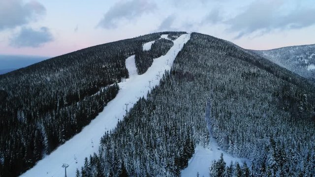 A steep snowy trail in Ramzova-Bonera-Serak ski resort in the Czech Republic - Wide shot