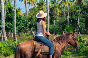 Horse ride through jungle in vacation.