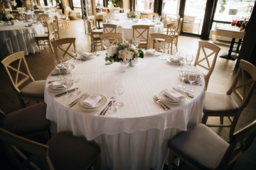  Round table in restaurant. Table decoration for dinner at a party