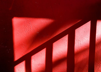 shadow on wall,  red abstract background - 324163701