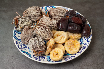 plate with different dried fruits