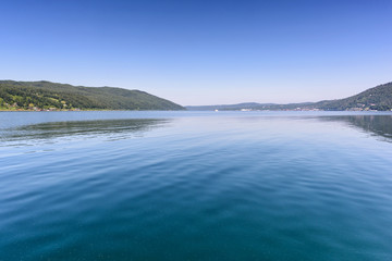 Obraz premium Lake Baikal close to village Port Baikal, Russia. Horizontal day view of the high shore and clear lake water