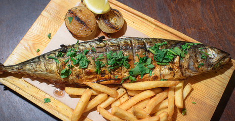 Delicious, fresh, baked mackerel in josper. Seafood. Healthy food. Close-up.