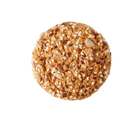Oatmeal cookies with grains of flax, sunflower and sesame seeds, isolated on a white background.