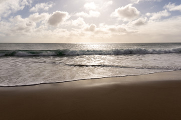 sunlit ocean beach