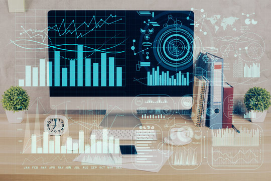 Forex graph hologram on table with computer background. Double exposure. Concept of financial markets.