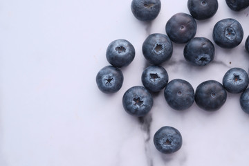 Close up of blue berry on white background 