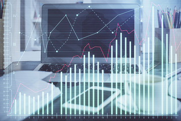 Double exposure of forex chart and work space with computer. Concept of international online trading.