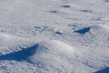 lunar landscape made of snow hills, snow desert