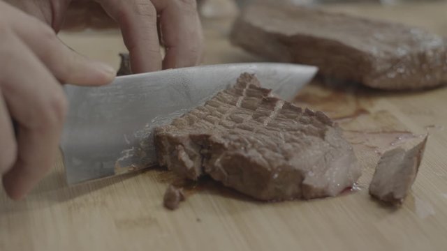 cutting meat with knife