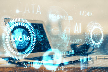 Double exposure of desktop computer and technology theme hologram. Concept of software development.