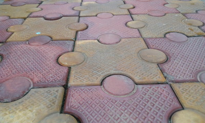 closeup image of 80 mm thick interlocking tile flooring laid outside of an residential building