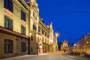 Obraz premium Modern city architecture. Night lighting of building in art Nouveau style. Riga, Latvia.