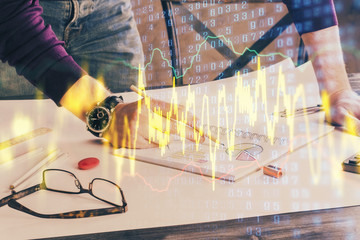 Financial trading chart double exposure with man desktop background.