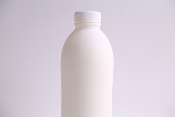 liquid yogurt bottle in color background