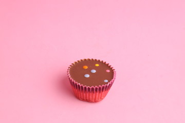 Chocolate cupcake with pink paper