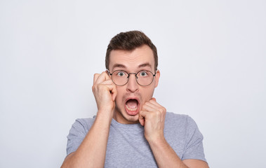 A surprised man with glasses opened his mouth.
