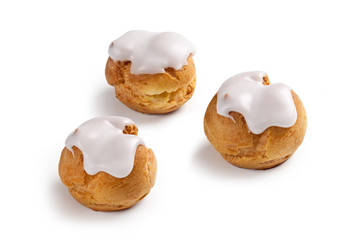 cream and chocolate puffs isolated on white background