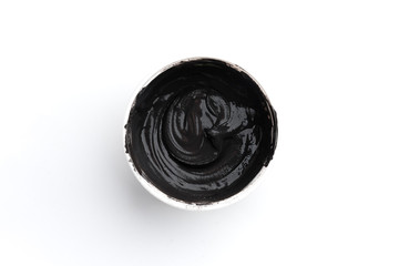 Black cement grout for filling gaps between the ceramic tiles isolated on white background.