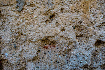 Surface of stone rock as grungy scratchy grainy texture background