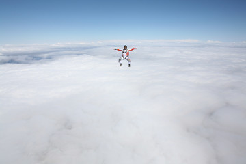 Force. Skydiver conquers the world. Skydiving team use professional equipment. Extreme sport for young men.