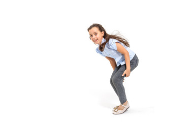 little girl jumps on a white background