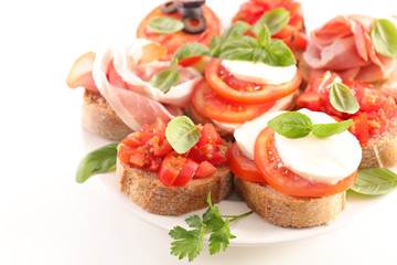 assorted of bruschetta- bread with tomato, cheese and basil