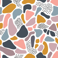 Seamless pattern abstract shapes Terrazzo mosaic style. Contemporary repeating background white pink blue golden fragments. Modern collage elements puzzle background. For decor, fabric, packaging 