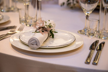 the restaurant is beautifully set for dinner.