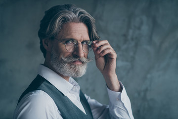 Close up photo of charismatic old dandy millionaire touch his expensive spectacles look dream...