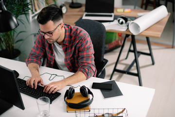 Man in office. Businessman working in office on his computer. 