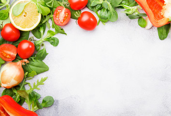 Healthy food background with various green herbs and vegetables. Ingredients for cooking salad. Vegetarian and vegan food concept. Top view, copy space