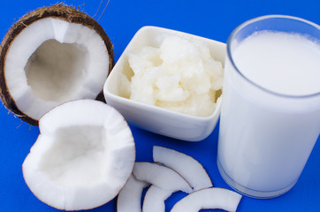 Homemade coconut milk, coconut oil, shavings and chips. The concept of healthy eating