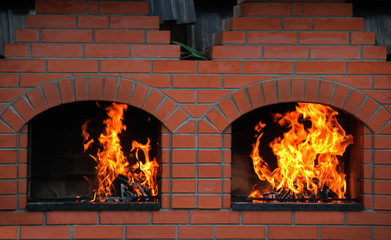 Wood Logs Burning In A Double Brick Oven   