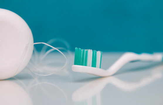 dental care, oral care products close-up on a light green background