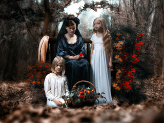 Children in a fairy-tale fantasy world. Portrait of three sisters