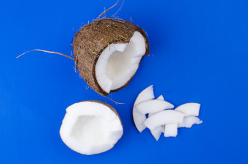 Close-up coconut, coconut shavings and coconut chips on a blue background. . 