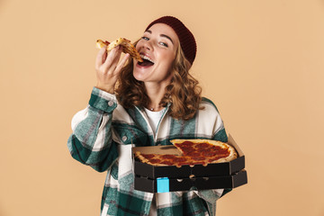 Photo of pretty happy woman smiling and eating pizza at camera