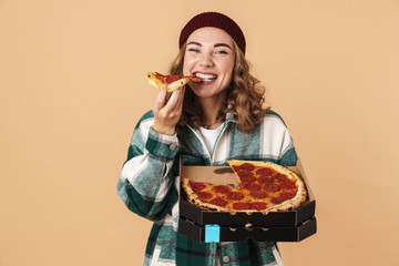 Photo of pretty happy woman smiling and eating pizza at camera