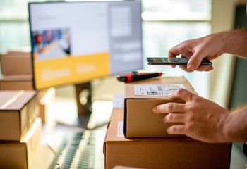 Delivery service, scanning a shipping label	