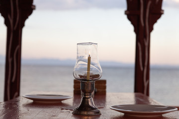 View of the Red sea from a restautant with a table set up with candle