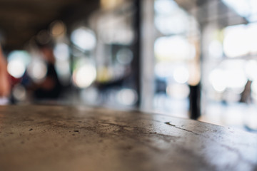 Closeup image of a concrete table with blur background in cafe