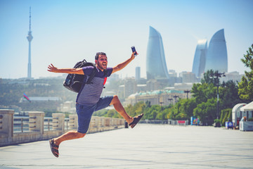Fototapeta na wymiar happy tourist take selfie photo in Baku, Capital of Azerbaijan. Travelling in Caucasus country