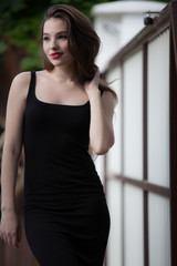 Portrait of beautiful young girl in summer garden.